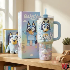 Bluey pastel tumbler with handle and straw displayed on a wooden shelf beside its box with books and toys nearby!