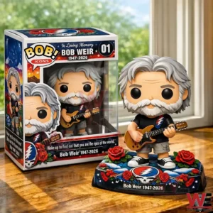 Collectible musician figure with gray hair and beard holding a guitar beside a themed display box on a table near a window!