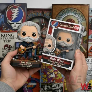 Vinyl musician figure with grey hair and beard holding a guitar next to a Grateful Dead 470 themed box held in hands with band artwork in the background!