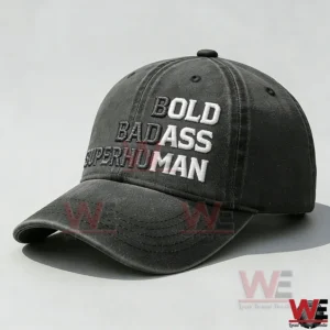 Bold Badass Super Human Embroidery Cap 5 Angled side view of a dark gray baseball cap with visible embroidered text and a curved stitched brim!