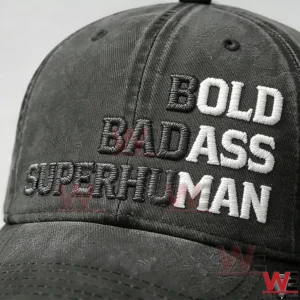 Bold Badass Super Human Embroidery Cap 7 Close up of bold embroidered lettering on a dark gray baseball cap showing detailed stitching and texture!