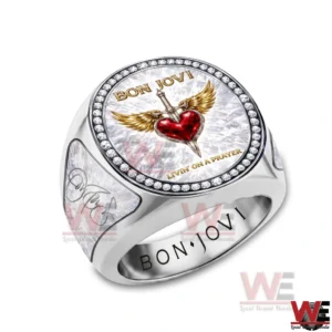 Bon Jovi Livin' On A Prayer Luxury Ring 4 Close up of a Bon Jovi ring showing the circular emblem with a winged heart and dagger surrounded by sparkling stones.