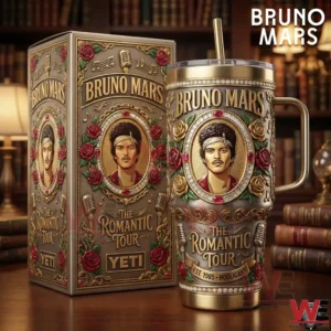 An ornate music themed tumbler with a matching box decorated with roses musical symbols and a central portrait placed on a wooden surface with books in the background!