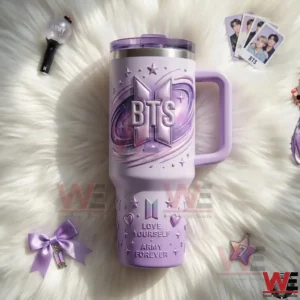 BTS purple insulated tumbler with handle placed on soft fabric with fan accessories!