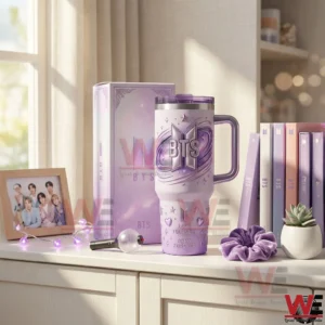 BTS themed insulated tumbler with handle displayed on a shelf with albums and soft lighting!