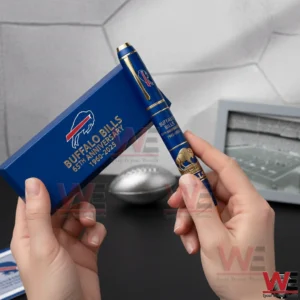 Buffalo Bills 65th Anniversary 1960-2025 Faithful Then Faithful Now Pen 3 Hands holding a blue and gold Buffalo Bills 65th anniversary pen beside a matching blue presentation box with team logo!