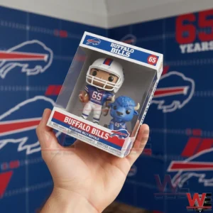 A hand holding a Buffalo Bills anniversary collectible box containing a football player figure and a blue buffalo mascot with team logos in the background!