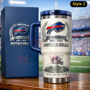 Cream colored insulated tumbler with navy handle and clear straw featuring Buffalo Bills sixty fifth anniversary graphics beside a navy collector box on a wooden table with a football stadium background!