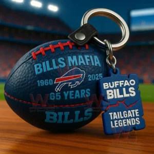 Blue football keychain with Bills Mafia text and Buffalo Bills Tailgate Legends tag on a table with stadium lights in the background.