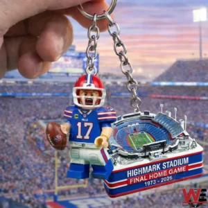 Hand holding a Buffalo Bills themed keychain with a player figure and a Highmark Stadium miniature charm labeled Final Home Game.