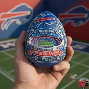 Hand holding a blue Buffalo Bills decorative egg with Highmark Stadium design on a football field background!