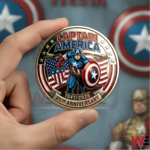 Hand holding a Captain America commemorative coin with bold superhero artwork and patriotic colors in a soft focused background!