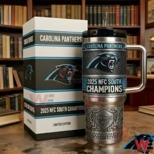 Carolina Panthers 2025 NFC South Champions Limited Edition Tumbler 5 Carolina Panthers themed 2025 NFC South Champions stainless steel tumbler with handle and straw displayed next to a matching gift box on a table in front of bookshelves in a library style room!