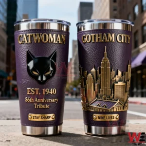 Two Catwoman inspired tumblers with purple and gold design cat mask symbol Gotham City skyline artwork and polished metal base placed on an urban street background!
