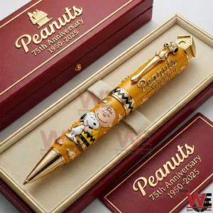 Peanuts seventy fifth anniversary collectible pen with Charlie Brown and Snoopy design placed inside a red and gold presentation box!