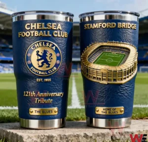 Two Chelsea insulated tumblers with blue textured exterior gold lettering club crest anniversary tribute and a three dimensional Stamford Bridge stadium design displayed on the football field!