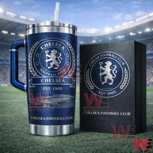 Blue Chelsea football club insulated tumbler with handle and straw next to a collector edition box on a football field with stadium stands behind!