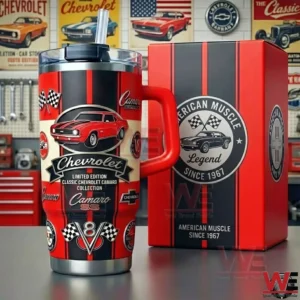 Alt text Red and black Chevrolet Camaro SS themed tumbler with handle and straw next to matching American Muscle Legend gift box in a vintage garage setting.
