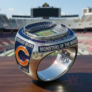 A Chicago Bears ring with a Soldier Field stadium model on top and side text reading Monsters Of The Midway plus Chicago Bears branding an orange C logo and an NFL shield shown in a stadium setting!