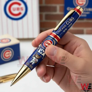Chicago Cubs 150th Anniversary 1876-2026 Pen 3 Hand holding a blue and gold Chicago Cubs commemorative ballpoint pen with team logo anniversary text and mascot artwork against a Chicago Cubs themed background.