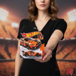 Hot Wheels Cincinnati Bengals themed car held in front of a football stadium!
