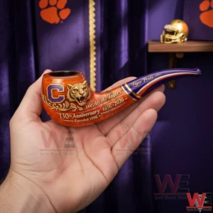 Hand holding a Clemson Tigers anniversary pipe with orange bowl tiger emblem and purple stem with gold accents!
