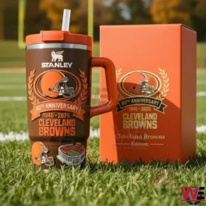 Brown Cleveland Browns anniversary insulated travel mug with orange lid handle and straw beside a matching orange gift box on a football field grass background!