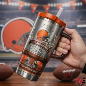 Hand holding a silver and orange Yeti tumbler with Cleveland Browns 80th anniversary helmet artwork and established year text!