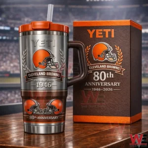 Cleveland Browns 80Th Anniversary 2026 Limited Edition 1946-2026 Yeti Tumbler 4 Silver Yeti tumbler with orange lid and Cleveland Browns anniversary design beside a matching anniversary box on a wooden table!