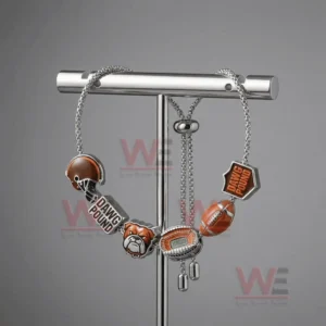 Adjustable Cleveland Browns themed charm bracelet hanging on a T bar stand with helmet Dawg Pound dog head stadium and football charms.