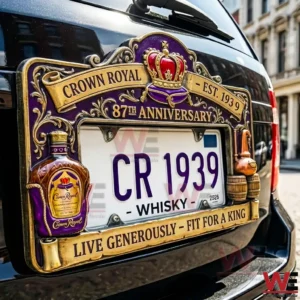 Purple and gold Crown Royal anniversary license plate frame on a car with crown emblem bottle and barrel details and the text CR 1939!