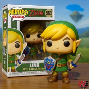 Cute Link Zelda 40th Anniversary 3D Pop Figure Vinyl 3 Link figure with sword and shield displayed on a wooden surface with the Heroes Games Zelda box behind it featuring Link 40th Anniversary details!
