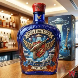 Rock band inspired collectible whiskey bottle displayed on a wooden bar with a themed box!