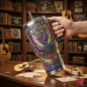 A Yeti tumbler with Dave Matthews Band butterfly artwork being held in a music room filled with instruments and vintage details!