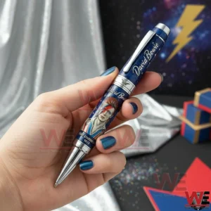 David Bowie Ziggy Stardust Era Pen 3 Hand holding a David Bowie Ziggy Stardust pen with a blue galaxy pattern and portrait artwork in the center!