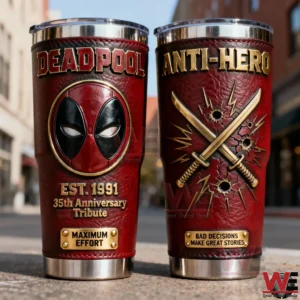 Two Deadpool inspired tumblers with red and gold design mask emblem crossed swords dynamic detailing and polished metal base placed on an urban street background!