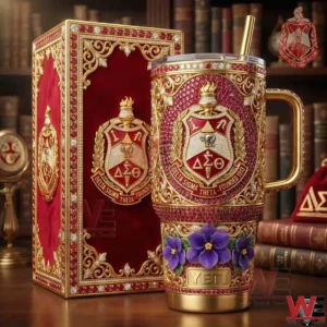 A Delta Sigma Theta insulated tumbler and matching presentation box displayed on a table with books and refined decor!