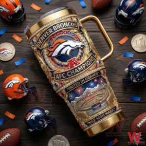 A Denver Broncos tumbler with gold design elements displayed on a wooden table with football gear around it!