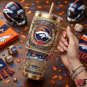 A hand holding a decorative Denver Broncos tumbler with fan items and celebratory details around it!