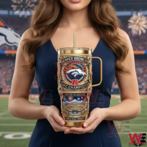 A woman holding a gold themed Denver Broncos tumbler on a football field during a celebratory moment!