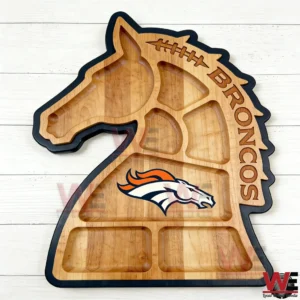 A Denver Broncos wooden charcuterie board shaped like a horse with empty compartments!