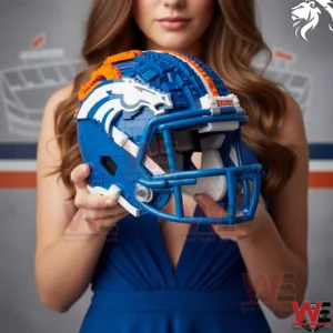 A close view of a woman holding a Denver Broncos building block football helmet with team colors and logo clearly visible!