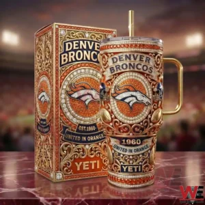 Front view of an orange and gold insulated tumbler with an ornate Denver Broncos design displayed next to a matching decorative box!