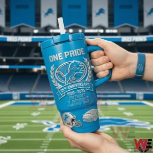 Detroit Lions 95th Anniversary One Pride 1930-2025 Edition Tumbler 4 Hands holding a blue Detroit Lions One Pride tumbler with handle and straw showing lion crest laurel wreath and 95th anniversary 1930 2025 design in a stadium setting