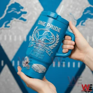 Detroit Lions 95th Anniversary One Pride 1930-2025 Edition Tumbler 5 Hands holding a blue Detroit Lions One Pride tumbler with handle and straw showing a lion crest laurel wreath and 95th anniversary 1930 2025 Detroit Lions design on a Lions themed background