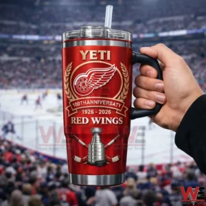 Hand holding a Detroit Red Wings centennial insulated tumbler inside a hockey arena!