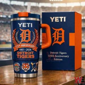 Navy and orange Detroit Tigers anniversary insulated tumbler with handle and straw beside a matching gift box in front of a blurred baseball stadium!