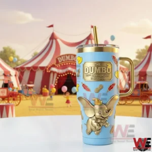 Light blue Dumbo metal tumbler with gold details standing before a bright circus setting!