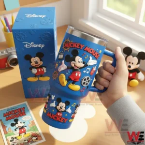 Hand holding a blue insulated tumbler with handle decorated with Mickey Mouse artwork!