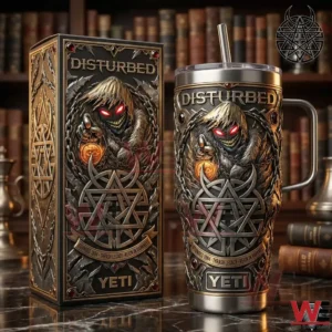 A Yeti tumbler and presentation box featuring Disturbed artwork placed in a moody environment with books and dark metal decor!